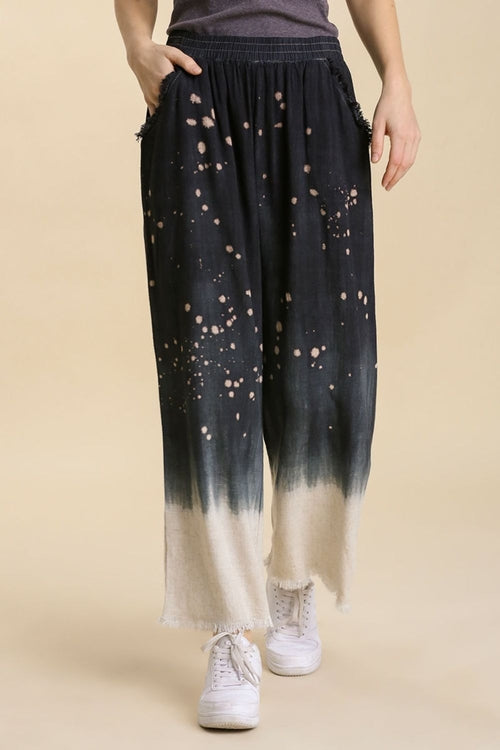 Jade Icarus Umgee linen blend bleach dip dye wide-leg pants shown in full size with raw hem detailing and relaxed fit.