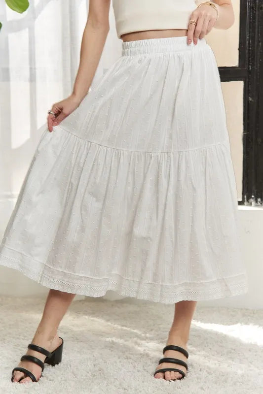 Jade Icarus ADORA elastic waistband tiered midi skirt with flowing fabric and layered design.
