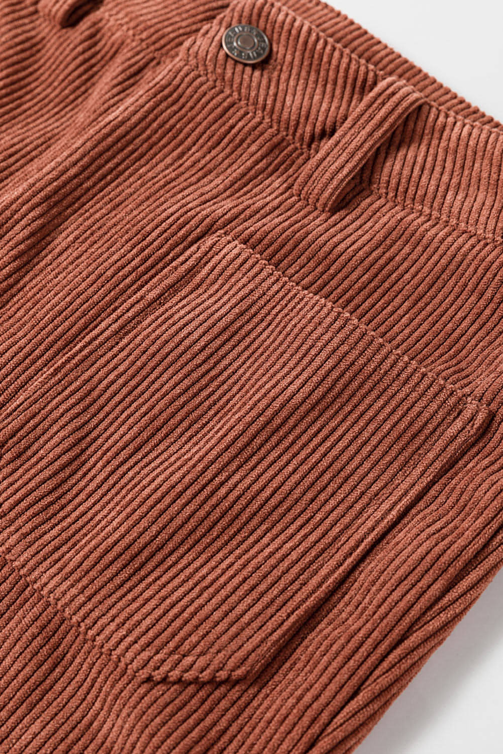 Brown high waist corduroy pants with square pockets by Carmine Juneberry, featuring a stylish and comfortable fit.