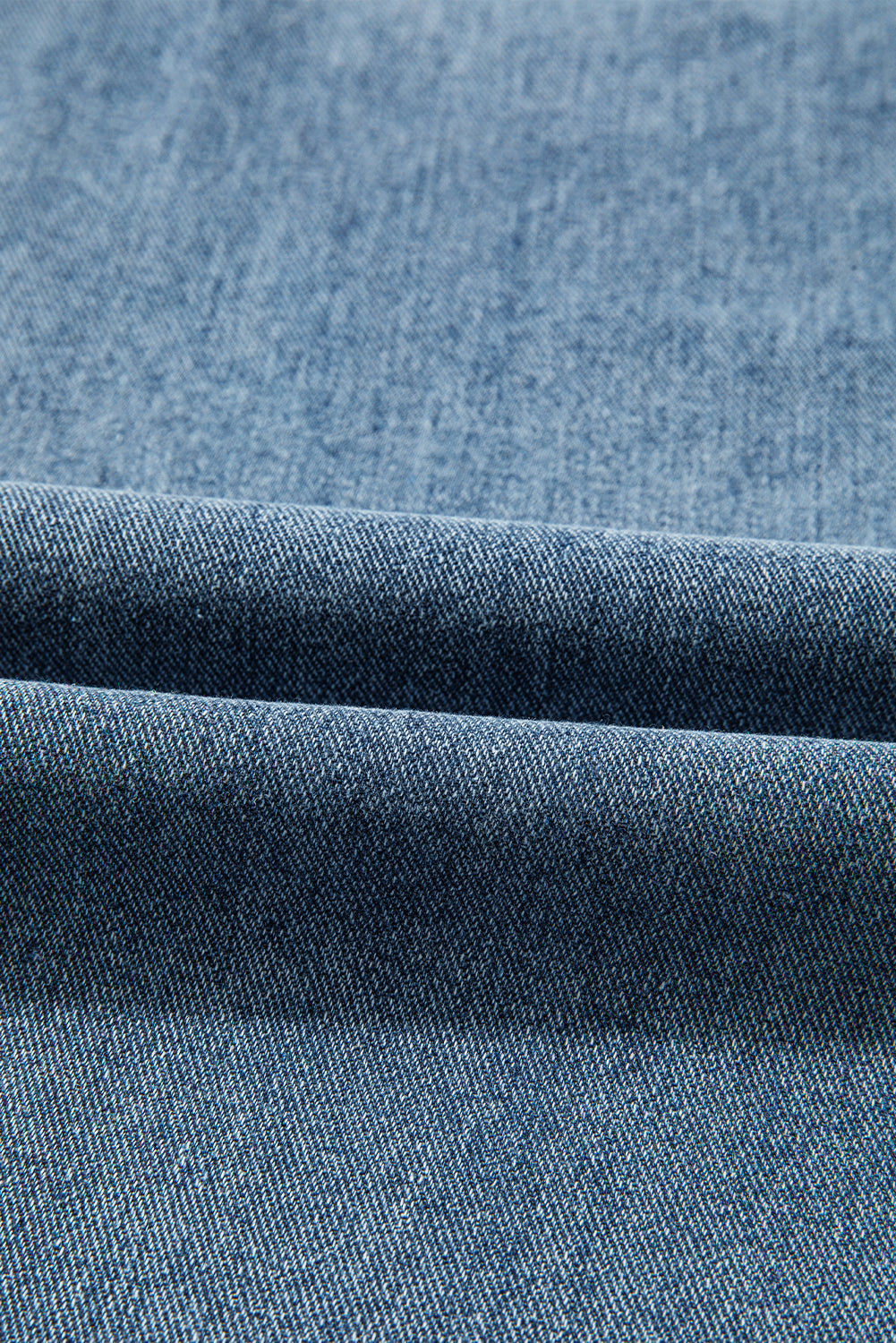 Byzantium Bay solid denim wide-leg jeans with embroidered details, showcasing a relaxed fit and stylish design.
