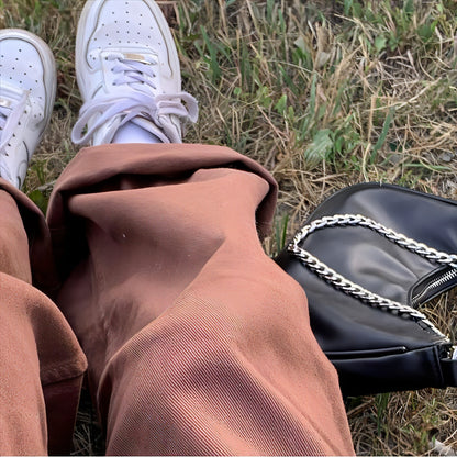 Carmine Juneberry brown retro American jeans with solid color design, slim fit, and classic denim look.