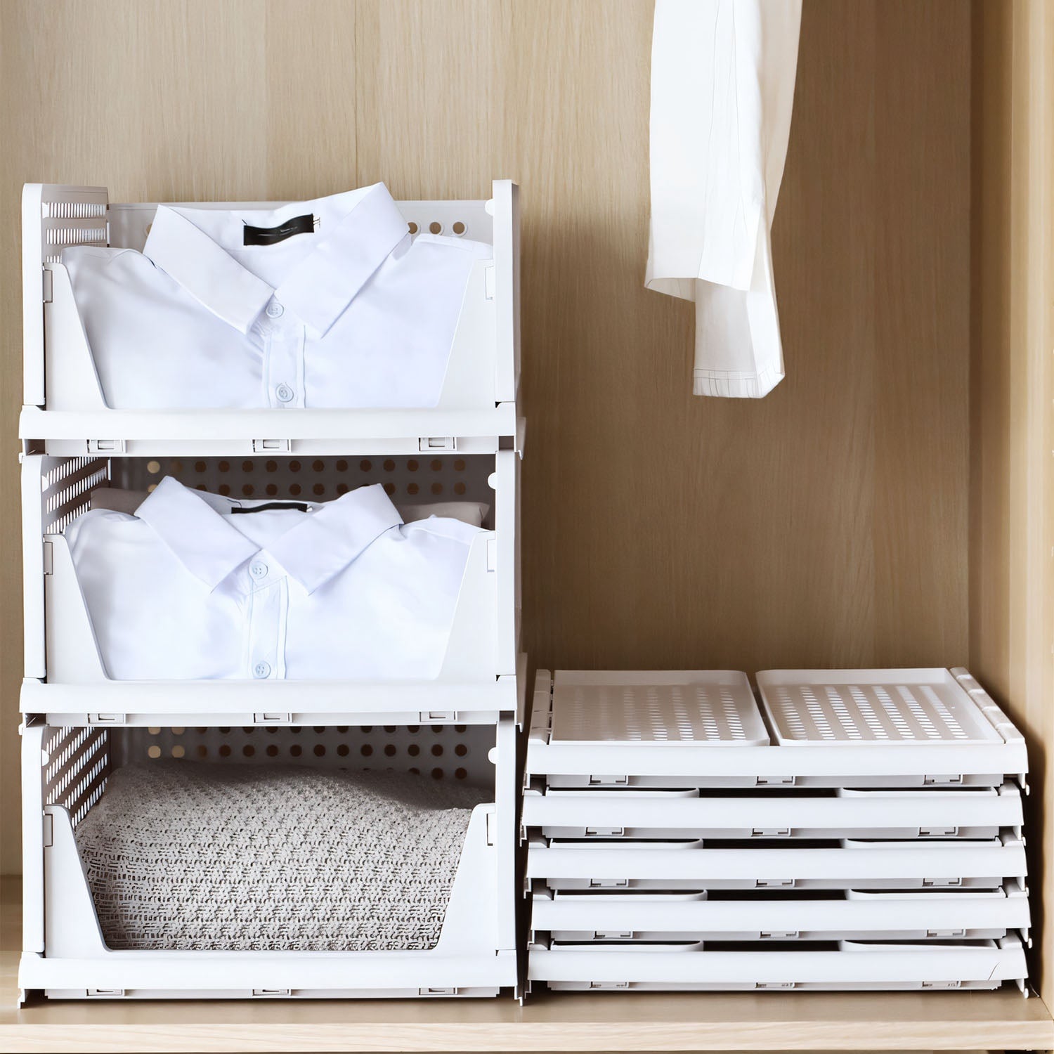 Four stackable plastic storage boxes with slide rails by Pear Daisy, ideal for organizing living room essentials.