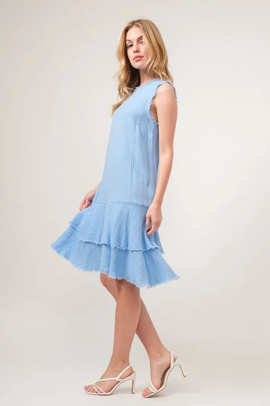 Jade Icarus washed fringe detail tiered dress with automotive-inspired design, featuring layered fabric and intricate fringe accents.