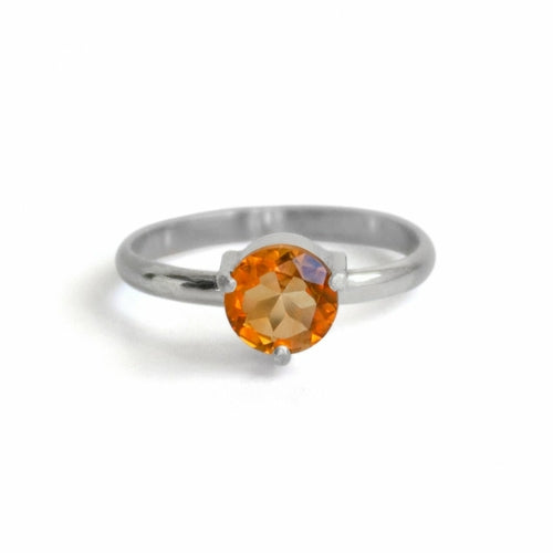 Sterling silver solitaire citrine ring with three-prong setting, featuring a vibrant yellow citrine gemstone.