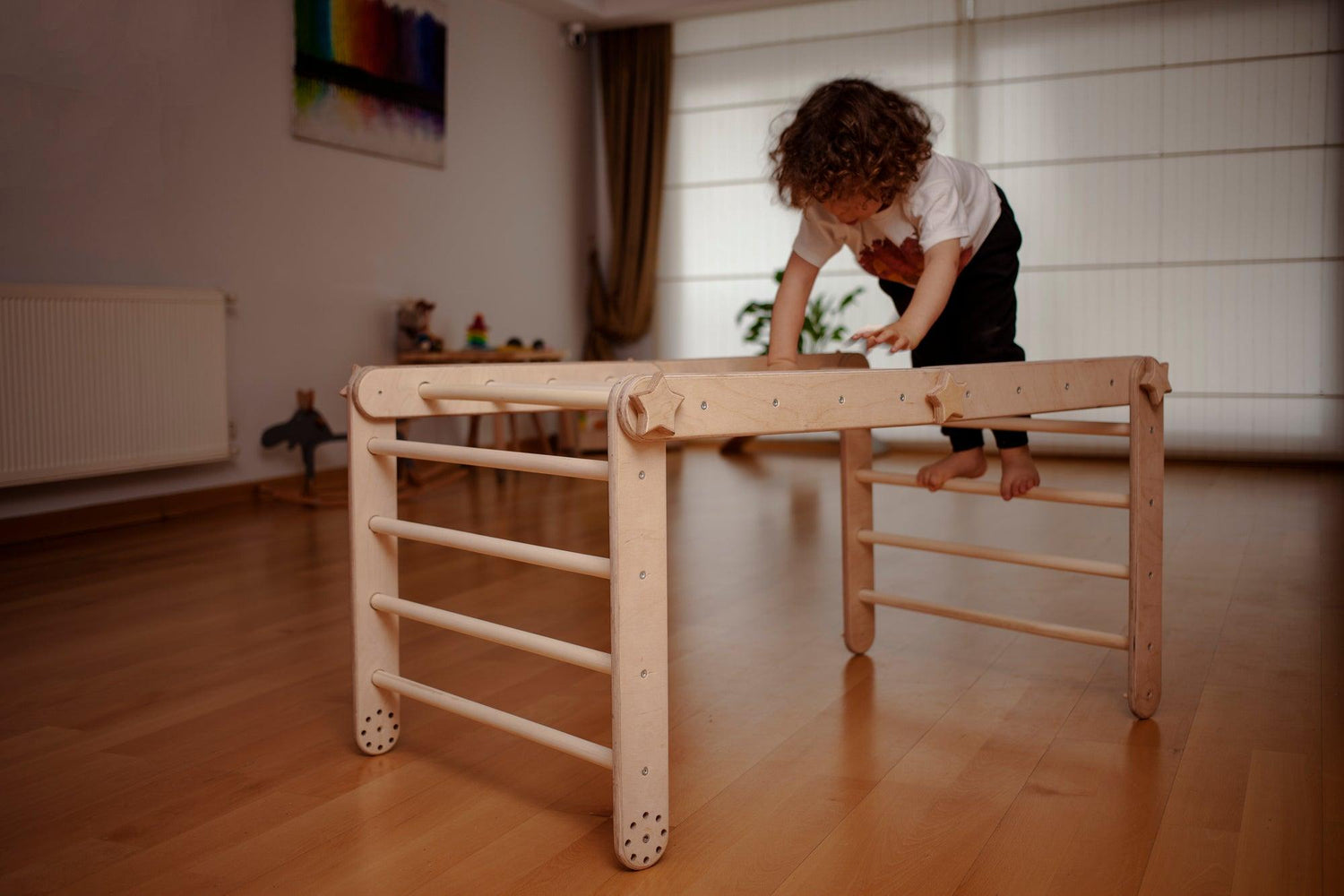 Red Oceanus transformable climbing cube with ramp, versatile furniture piece for play and activity spaces.