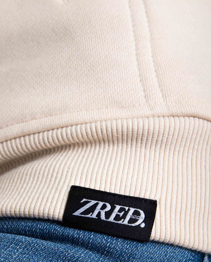 Close-up of a sand-colored HIGH STD Hoodie by Pear Juniper, showcasing the soft fabric and hood design for women&