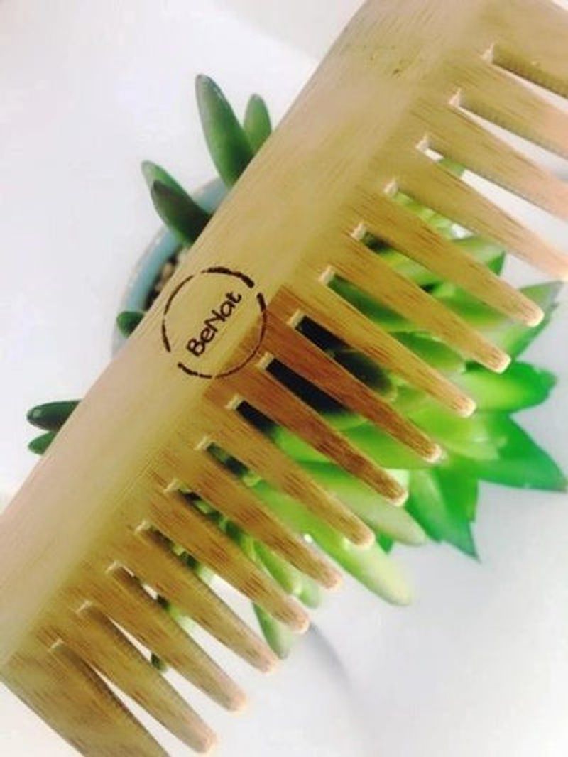 All-natural bamboo hair comb by Violet Atlas, designed for gentle detangling and eco-friendly hair care in bath and beauty routine.