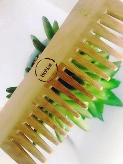 All-natural bamboo hair comb by Violet Atlas, designed for gentle detangling and eco-friendly hair care in bath and beauty routine.