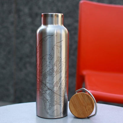 Cyan Castor Cormorant Lake Manitoba map bottle with bamboo top, houseware item featuring detailed lake and map design.