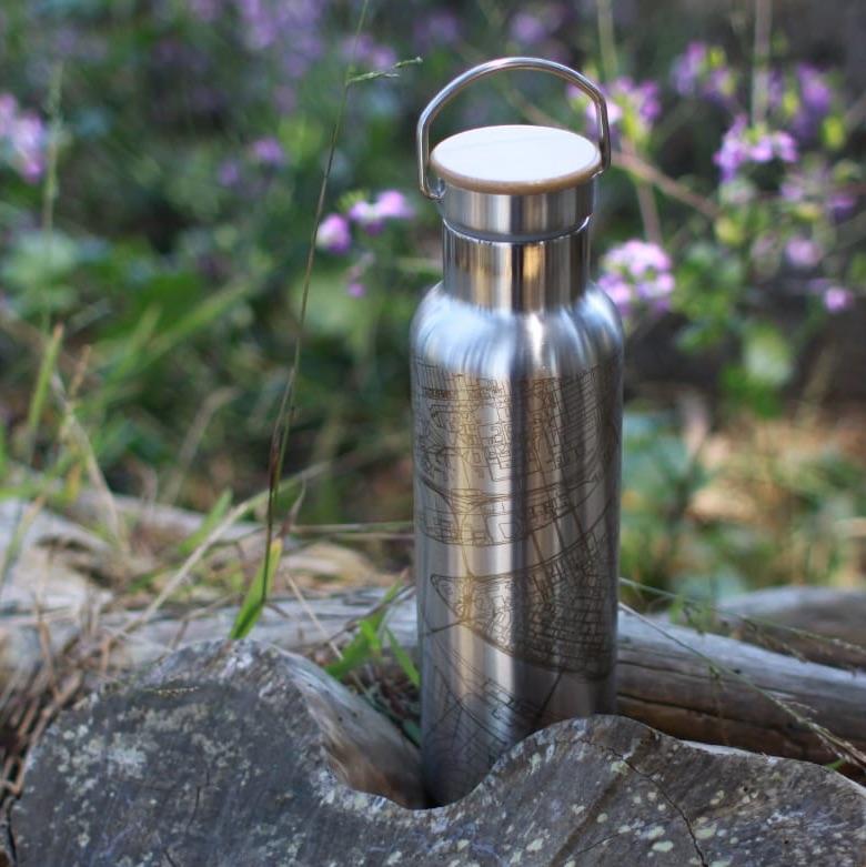 Cyan Castor Cormorant Lake Manitoba map bottle with bamboo top, housewares item featuring detailed lake and map design.