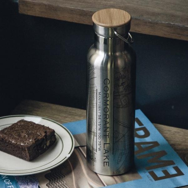Cyan Castor Cormorant Lake Manitoba map bottle with bamboo top, eco-friendly houseware for drinking or display.