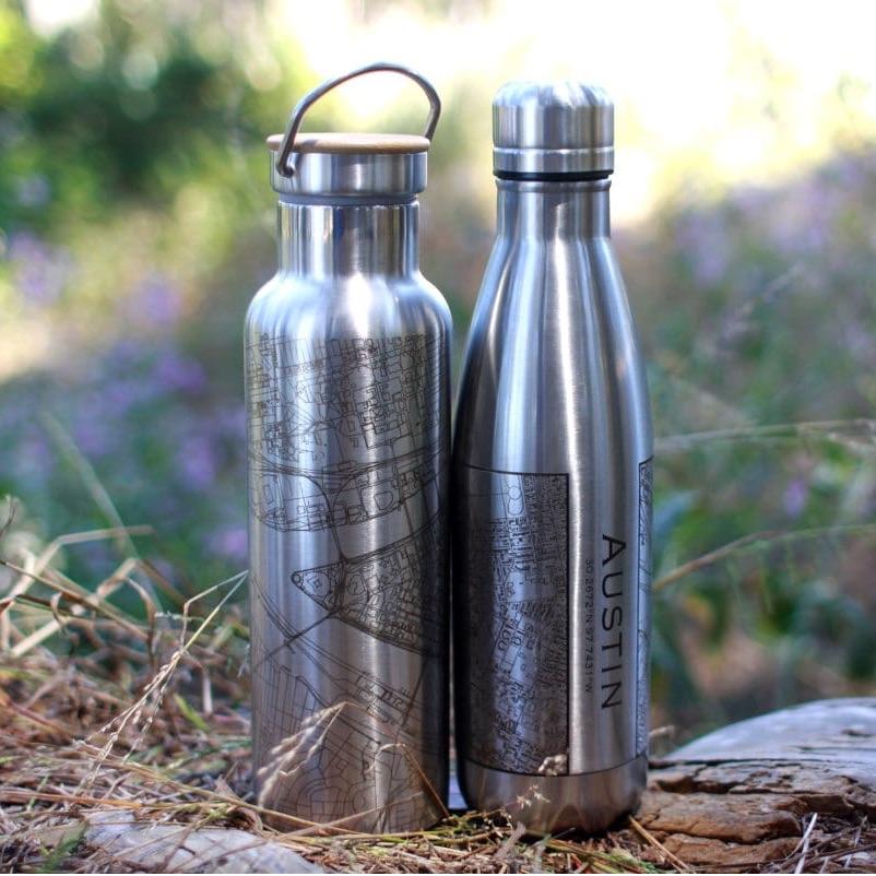 Insulated bottle featuring a Cormorant Lake Manitoba map design by Cyan Castor, ideal for housewares and outdoor use.