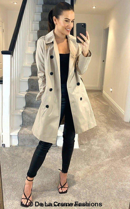 Rose Eleusis cotton blend belted trench coat worn by a model, showcasing classic collar, waist belt, and long sleeves.
