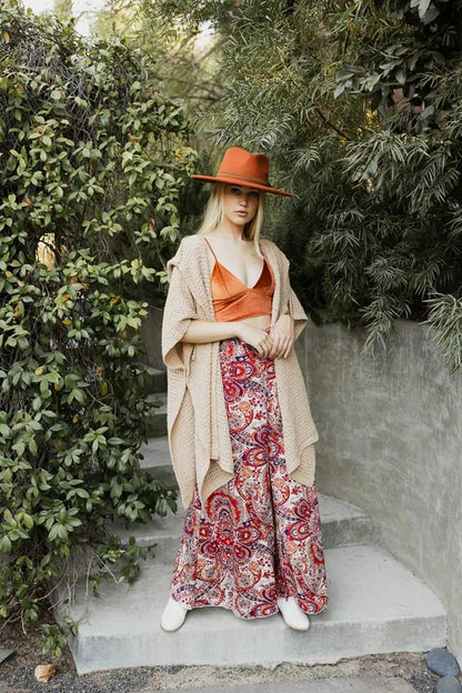 Beige cozy soft waffle hooded ruana by Periwinkle Aether, featuring a warm, relaxed fit and a stylish hood for comfort and style.