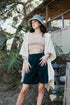 Soft ivory waffle hooded ruana by Periwinkle Aether, cozy accessories with a relaxed fit and stylish hood for comfort.
