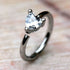 Peridot Prong Set Heart CZ seamless ring showcasing sparkling heart-shaped cubic zirconia jewelry design