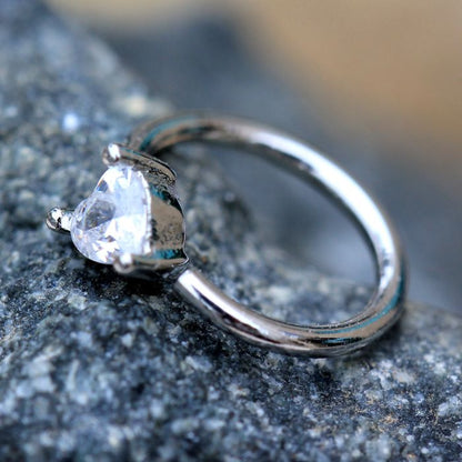 Silver prong set heart-shaped CZ seamless ring by Peridot, featuring sparkling cubic zirconia stones and a smooth band.