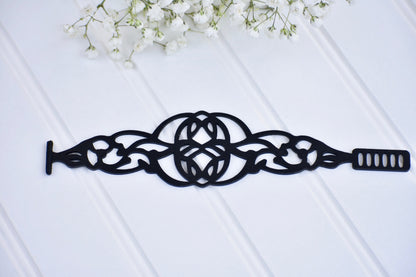 Black Rose Brave Bracelet, stylish jewelry piece featuring a sleek design with intricate details in silver-tone metal.