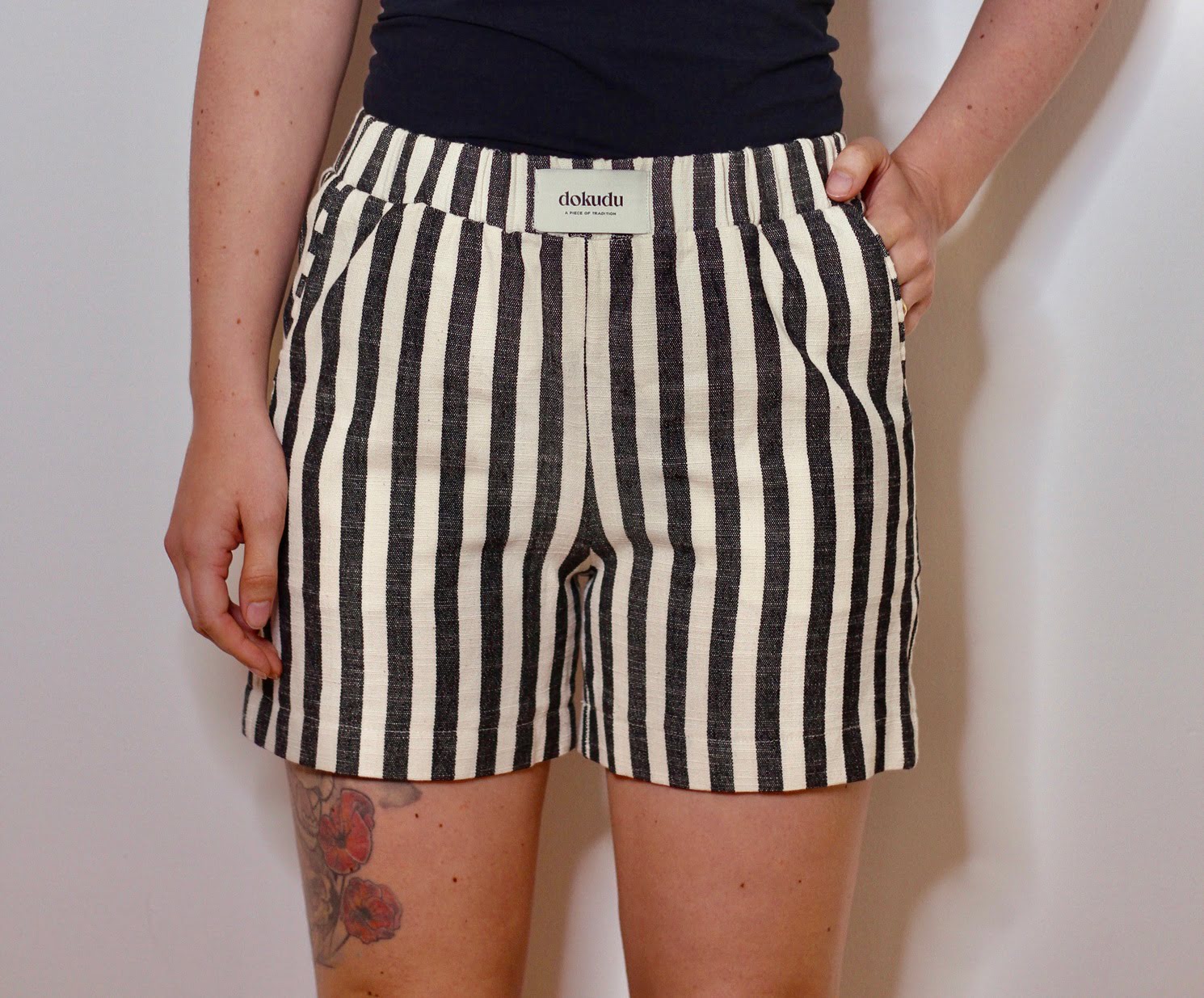 Black handwoven shorts by Blue Helios, featuring a stylish, textured design suitable for casual wear.