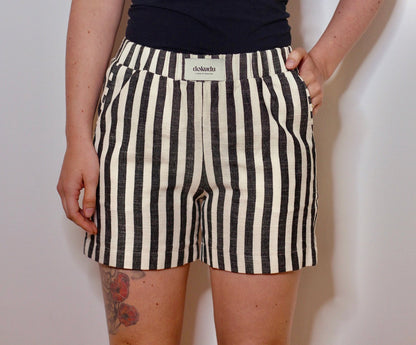 Black handwoven shorts by Blue Helios, featuring a stylish, textured design suitable for casual wear.