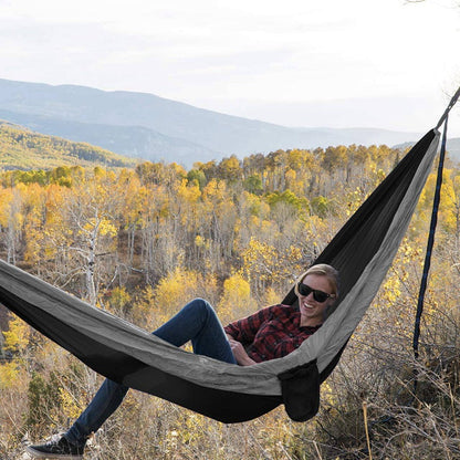 Maroon Asteria camping parachute hammock ideal for outdoor survival, garden relaxation, featuring lightweight, durable fabric and easy setup.
