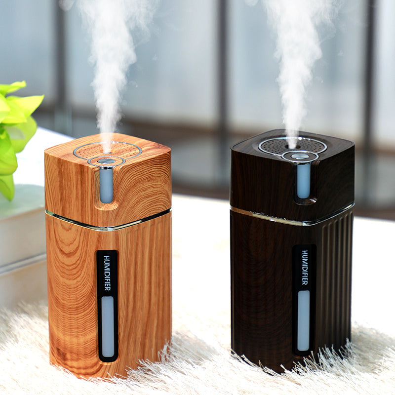 Maroon Asteria ultrasonic USB mini air humidifier with LED light, emitting mist for home improvement and air quality enhancement