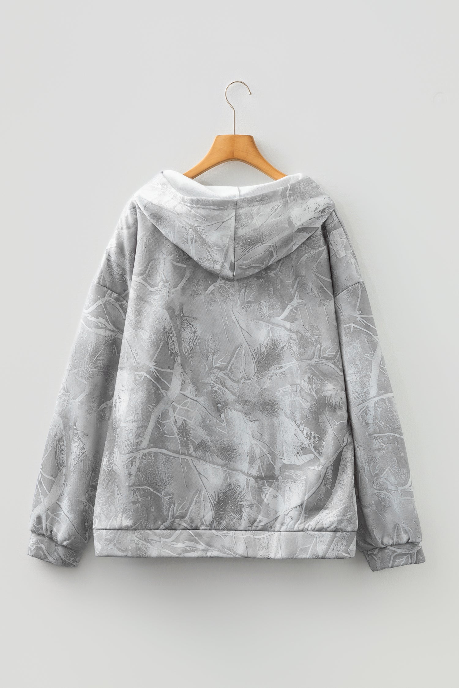 Plus size camouflage woodland hoodie by Byzantium Bay, oversized sweater with camo print, soft fabric, and relaxed fit.