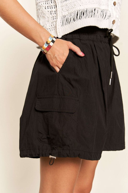 Jade Icarus ADORA drawstring shorts with pockets, featuring a casual automotive style and comfortable fit.