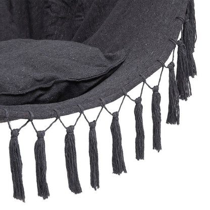Gray LuneluX boho hanging chair by Carmine Juneberry with fringe and cushions, showcasing its cozy, stylish furniture design.