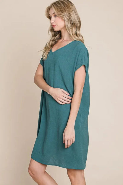 Jade Icarus BOMBOM V-Neck Short Sleeve Dress for women with pockets, shown in a casual black design.