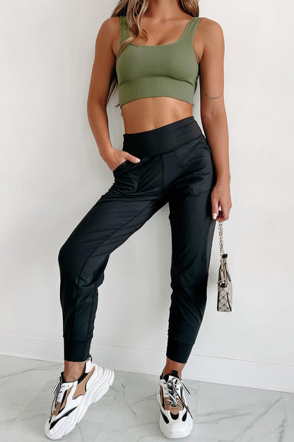 Black exposed seam high waist joggers with pockets, stylish and comfortable, by Carmine Juneberry.