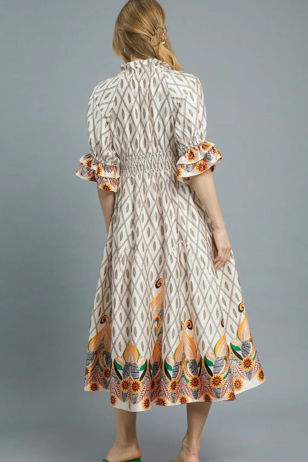 Pear Daisy Umgee printed smocked waist flounce sleeve midi dress shown with floral print and flowing silhouette.