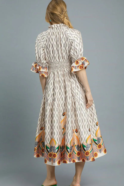 Pear Daisy Umgee printed smocked waist flounce sleeve midi dress shown with floral print and flowing silhouette.