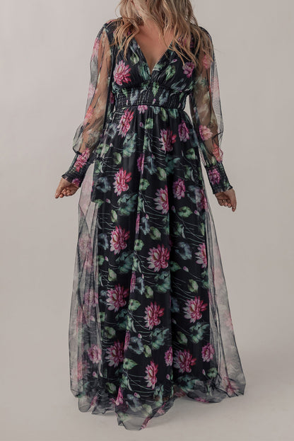 Black mesh sheer floral maxi dress with shirred high waist from Harlequin Daisy, featuring a flowing, elegant design.