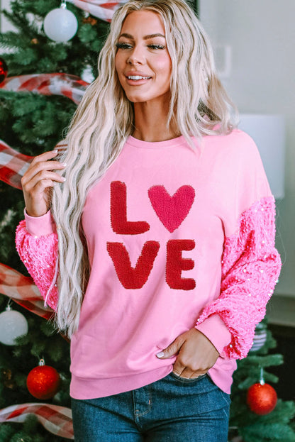 Pink Valentines LOVE Chenille embroidered sequin sleeve sweatshirt by Harlequin Daisy, featuring embroidered love message and shiny sequin sleeves.