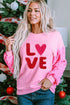 Pink Valentines LOVE chenille embroidered sequin sleeve sweatshirt from Harlequin Daisy, featuring soft fabric and decorative embellishments.
