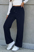 Navy blue fleece-lined casual pants with drawstring waist by Carmine Juneberry, cozy and comfortable for everyday wear.