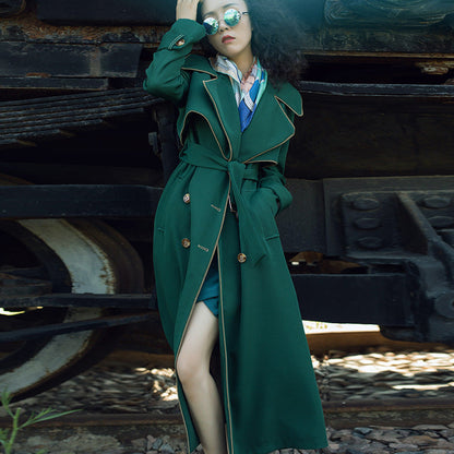 Long British style double-breasted coat by Carmine Juneberry, tailored jacket with classic design and warm fabric.