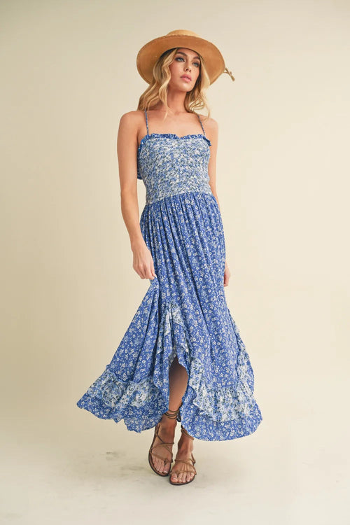 Aemi + Co Ditsy Floral Ruffled Hem Maxi Cami Dress featuring a floral print and ruffled hem, displayed on a hanger.