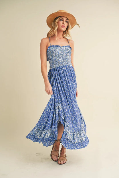 Aemi + Co Ditsy Floral Ruffled Hem Maxi Cami Dress featuring a floral print and ruffled hem, displayed on a hanger.