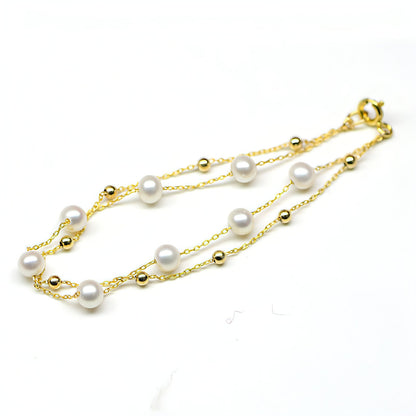 Carmine Juneberry 18k gold seawater pearl adjustable double-layer bracelet with elegant design and clasp closure.