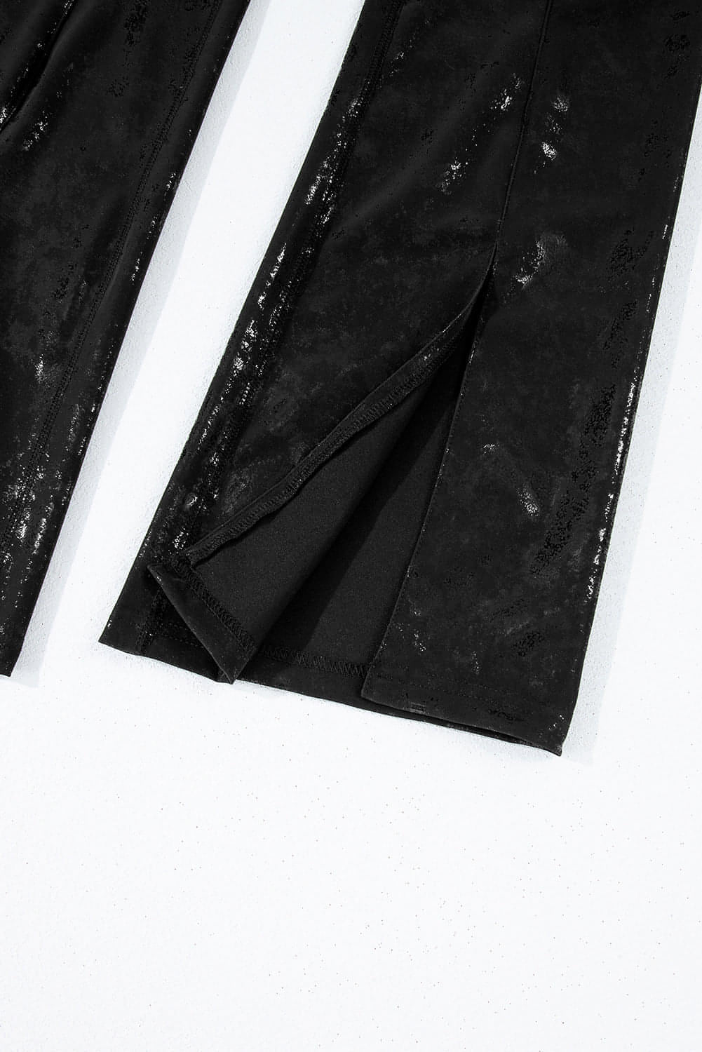 Black faux leather splits high waist leggings by Carmine Juneberry, featuring a sleek fit and stylish design.
