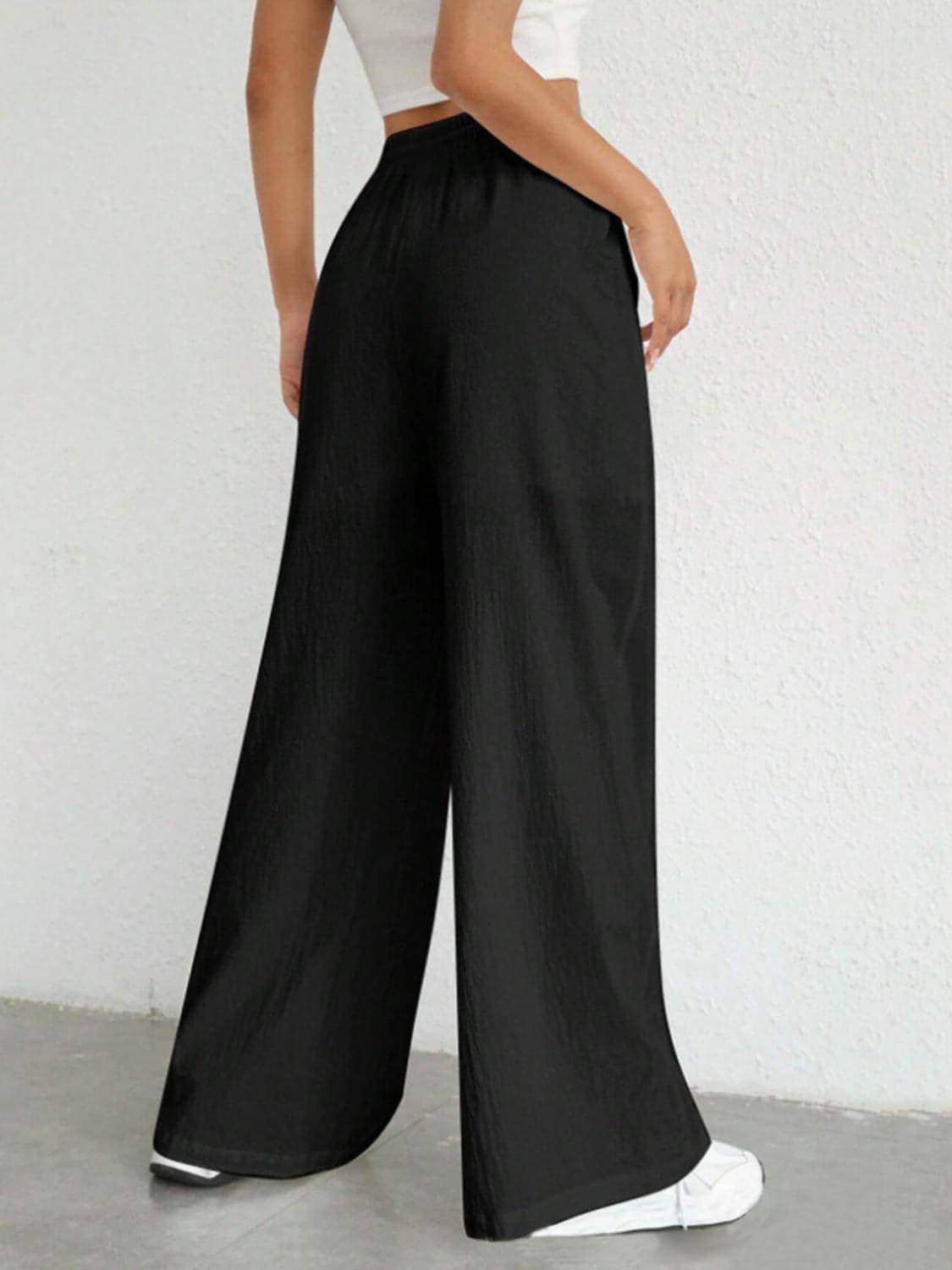 Carmine Juneberry drawstring wide-leg pants in soft fabric with a relaxed fit and elastic waistband, shown on a model.