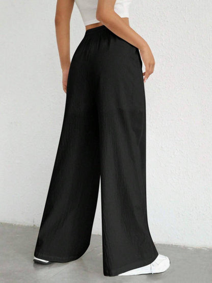 Carmine Juneberry drawstring wide-leg pants in soft fabric with a relaxed fit and elastic waistband, shown on a model.