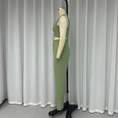 Carmine Juneberry matching set featuring a short crop-top with spaghetti straps and high-waist trousers, stylish two-piece outfit.