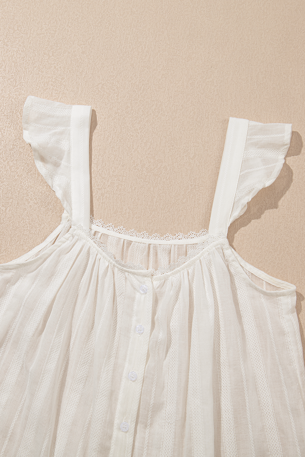 White lace crochet ruffle buttoned tank top for women by Byzantium Bay, featuring delicate details and a stylish fit.