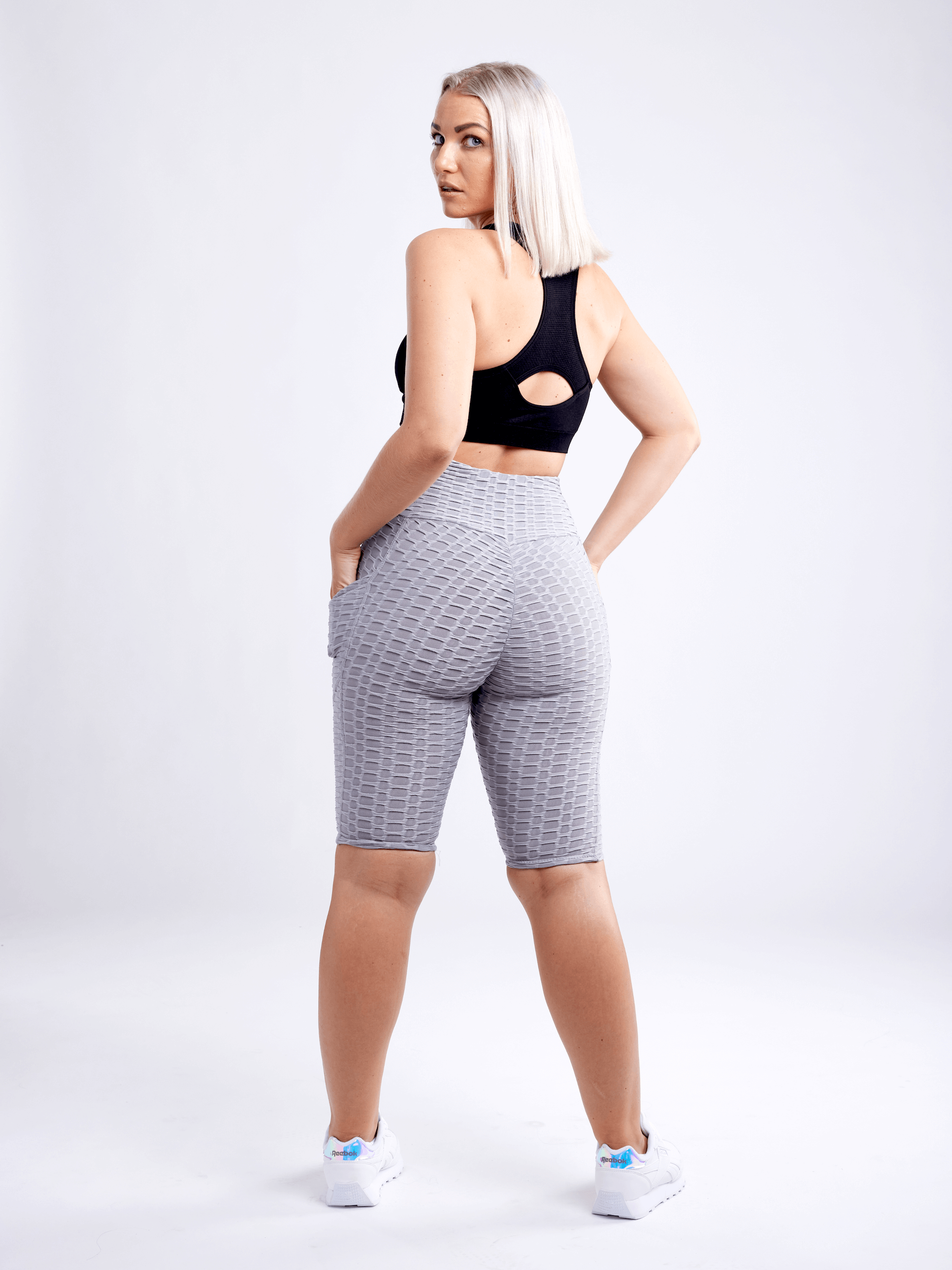 Black Lavender JupiterGear high-waisted scrunch yoga shorts with hip pockets, showcasing a comfortable activewear design.