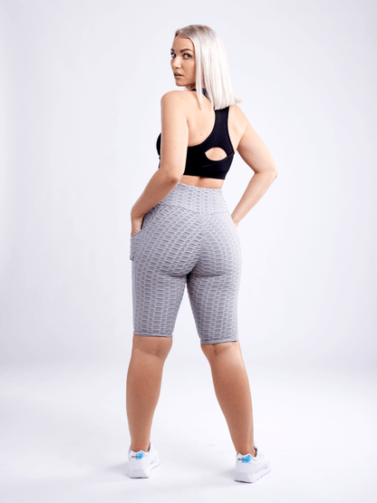 Black Lavender JupiterGear high-waisted scrunch yoga shorts with hip pockets, showcasing a comfortable activewear design.
