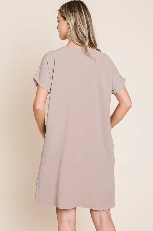 Automotive-themed Jade Icarus BOMBOM V-Neck Short Sleeve Dress with Pockets, featuring a stylish design and comfortable fit.