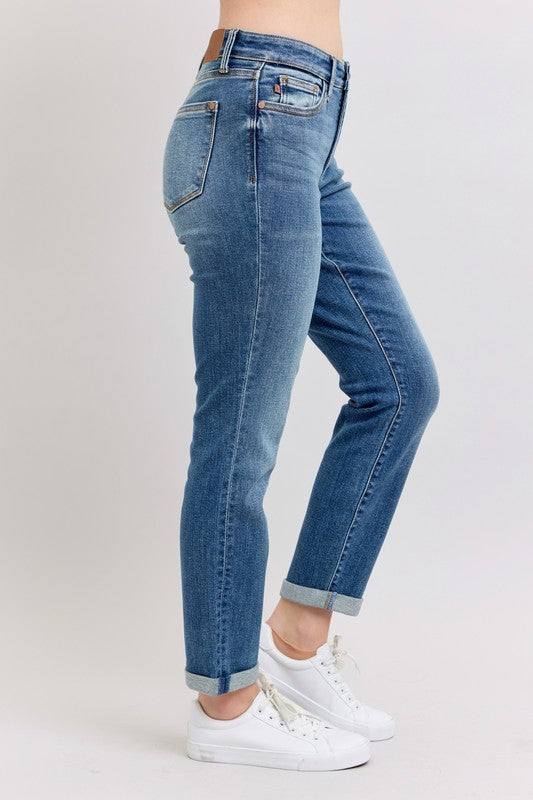 Judy Blue full size mid-rise skinny cuff jeans with pockets for women, plus size, in a dark denim wash, displayed on a model.